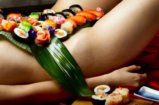 sushi placed on a sexy vagina and stomach