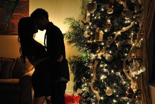 making out by xmas tree