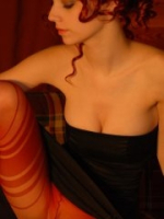 Dominatrix with a focus on sensual control and punishment 