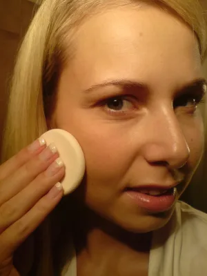 Just a girl putting on her makeup